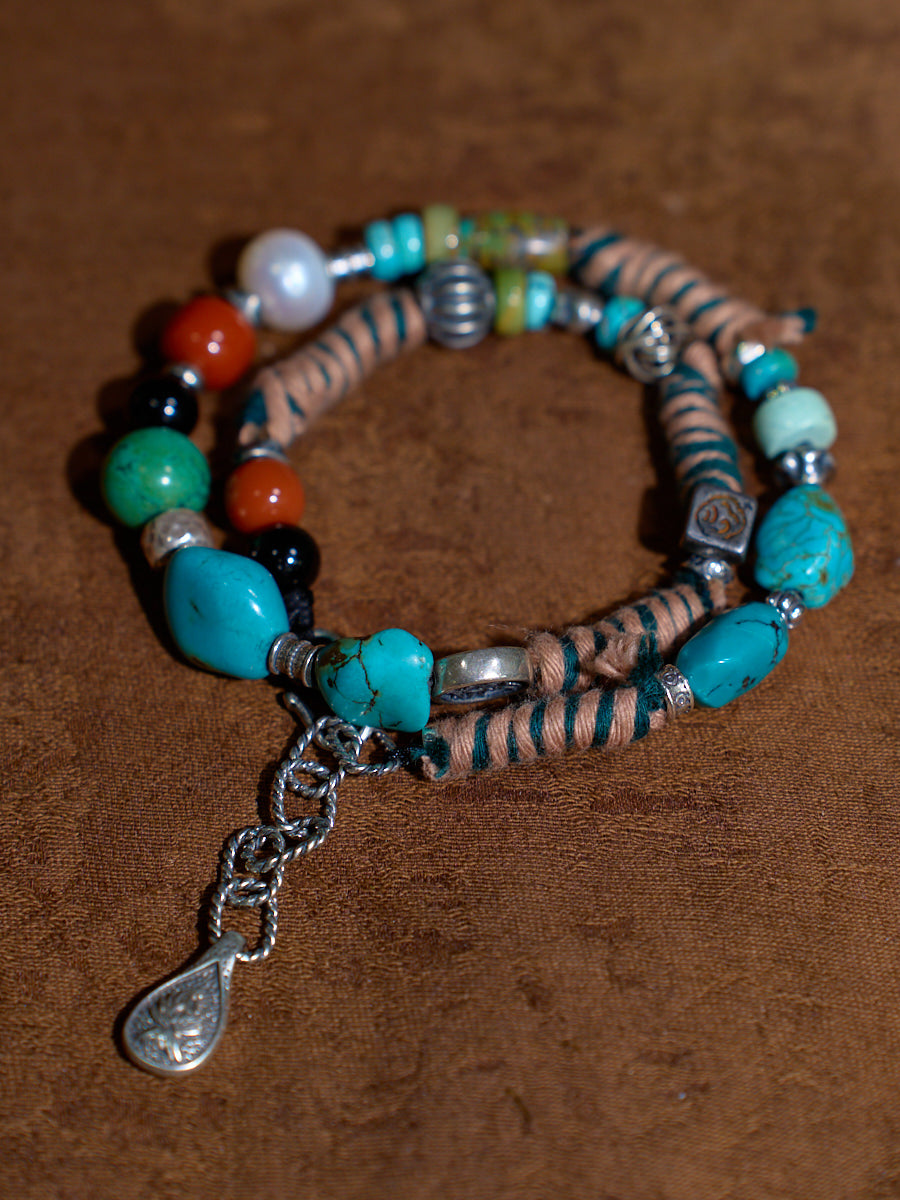 EastKarma BLESSING HARMONY BRACELET WITH TURQUOISE, AGATE, BLACK CRYSTAL, AND PEARL – A HIMALAYAN TALISMAN OF PROTECTION